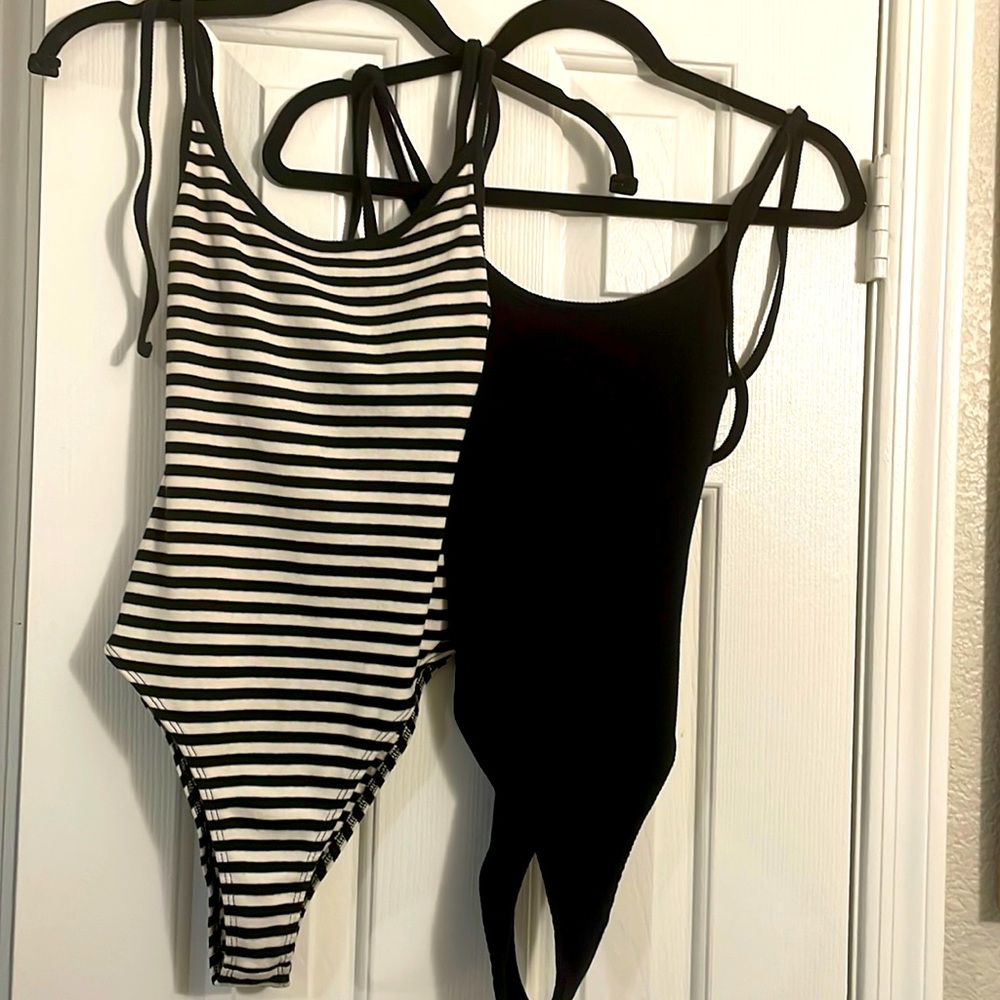 Two cute, bodysuits that tie at the shoulder.